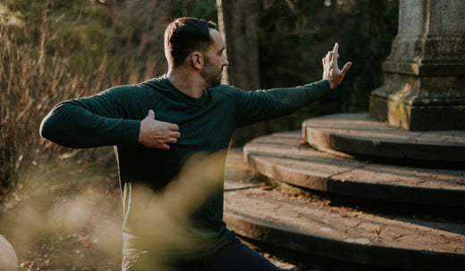 Arron demonstrating a morning Qigong routine to boost energy, improve circulation, and release tension with mindful movements.