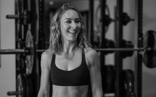 Amy Williams, Olympic gold medallist and personal trainer, smiling confidently as the face of expert-backed fitness and healthy habits advice.